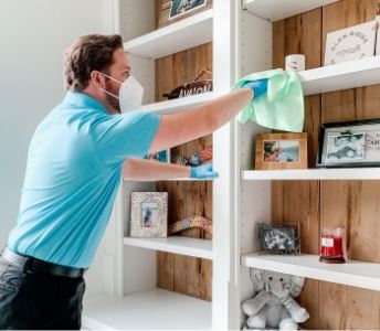 man and woman laughing in a kitchen